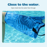 Close-up of the DriftLeaf pool hammock open mesh sling and stitched black strap in the water.
