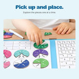Hands placing a green fraction piece on the original open FractionMaster board.