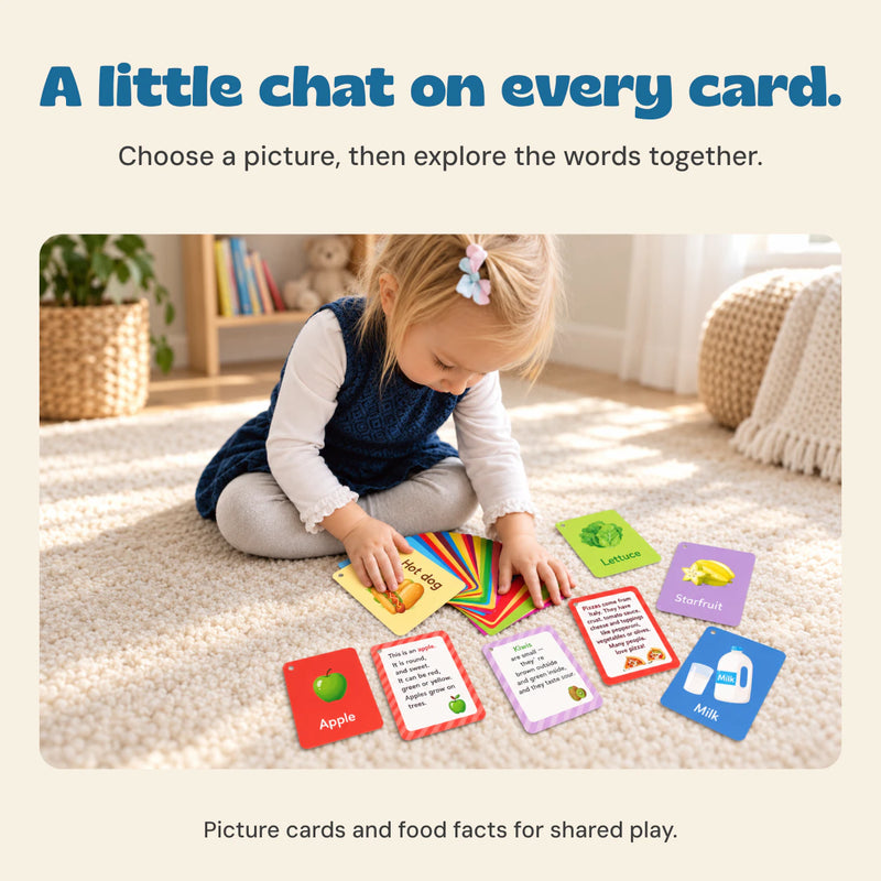 The child from the original product photo explores a fan of Food Friends flashcards on a sunlit cream rug.