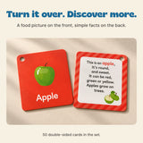 Apple flashcard front and reverse shown together on a warm beige tabletop, with a picture on one side and food facts on the other.