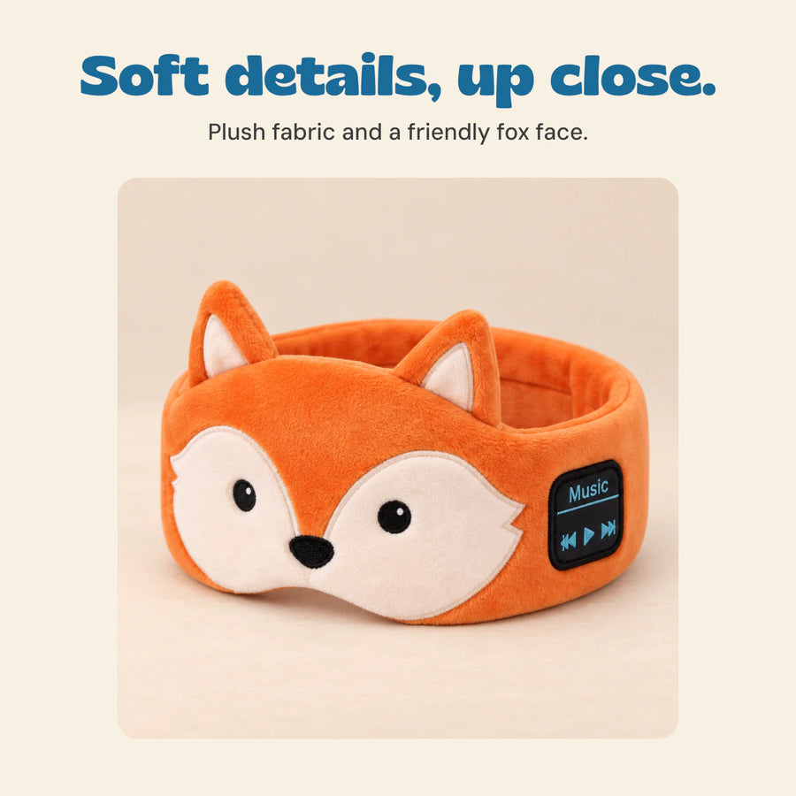 Close view of the orange fox headband and its embroidered face.