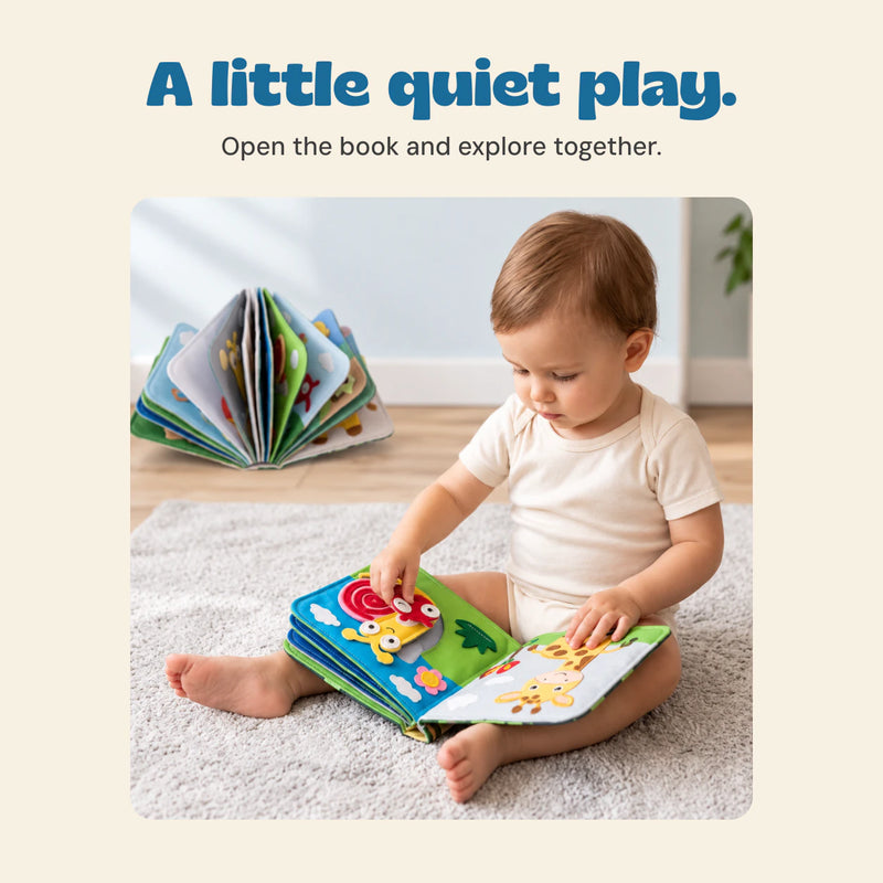 Child playing with a BusyBuddy felt activity book in the original home setting.