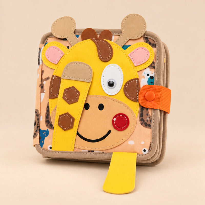 Giraffe BusyBuddy variant showing its actual giraffe-face felt cover and orange closing tab.