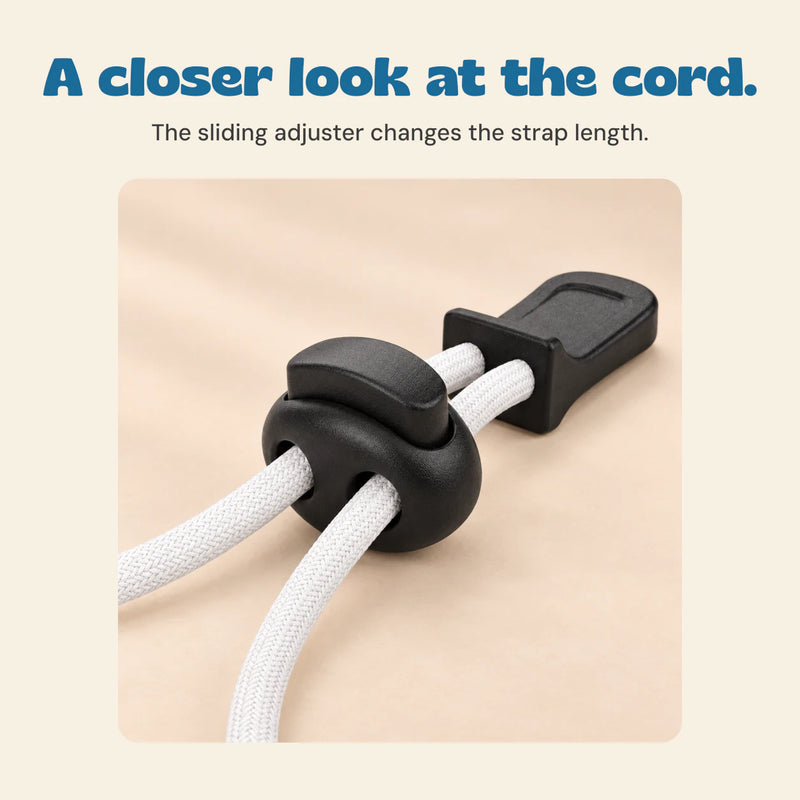 Close detail of the black sliding cord adjuster on SplashView swim goggles.