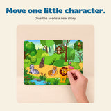 Hand placing a lion sticker into the animal jungle scene.