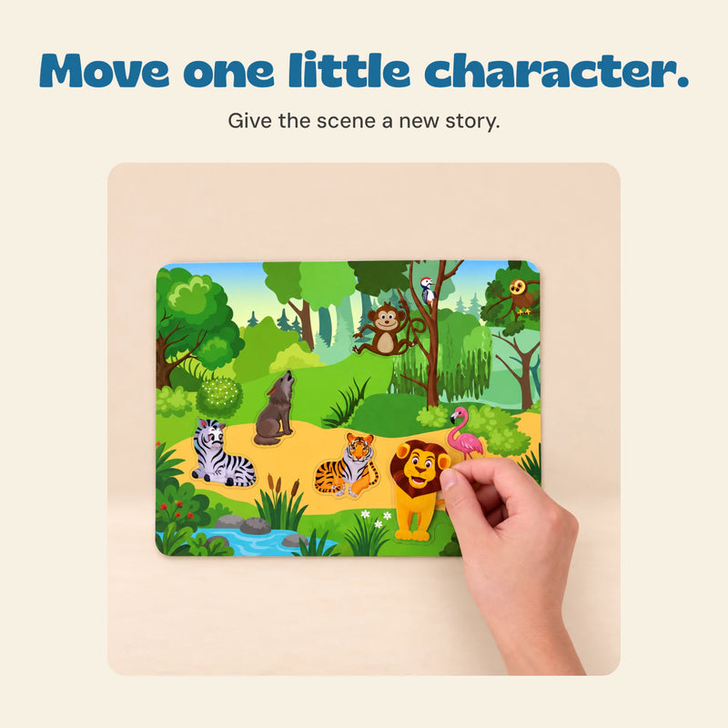 Hand placing a lion sticker into the animal jungle scene.