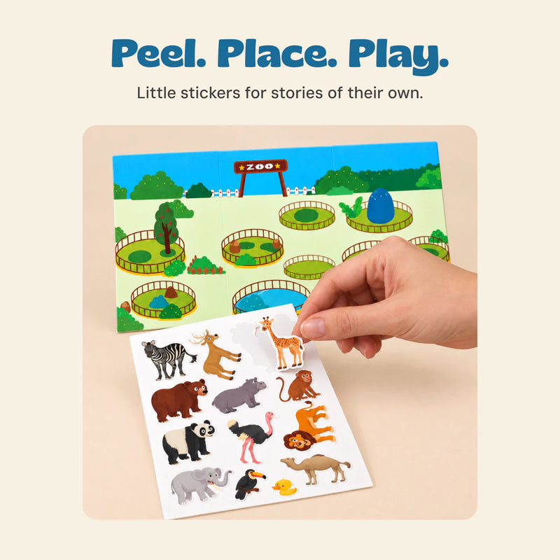 A hand lifting a giraffe sticker from the actual Zoo sticker sheet.