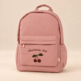 Little Explorer Large Backpack. Clean product photograph on a warm beige studio surface.