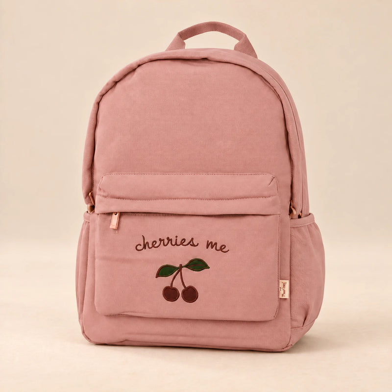 Little Explorer Large Backpack. Clean product photograph on a warm beige studio surface.