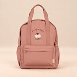 Little Explorer Large Backpack. Cupcake Rose. Clean product photograph on a warm beige studio surface.