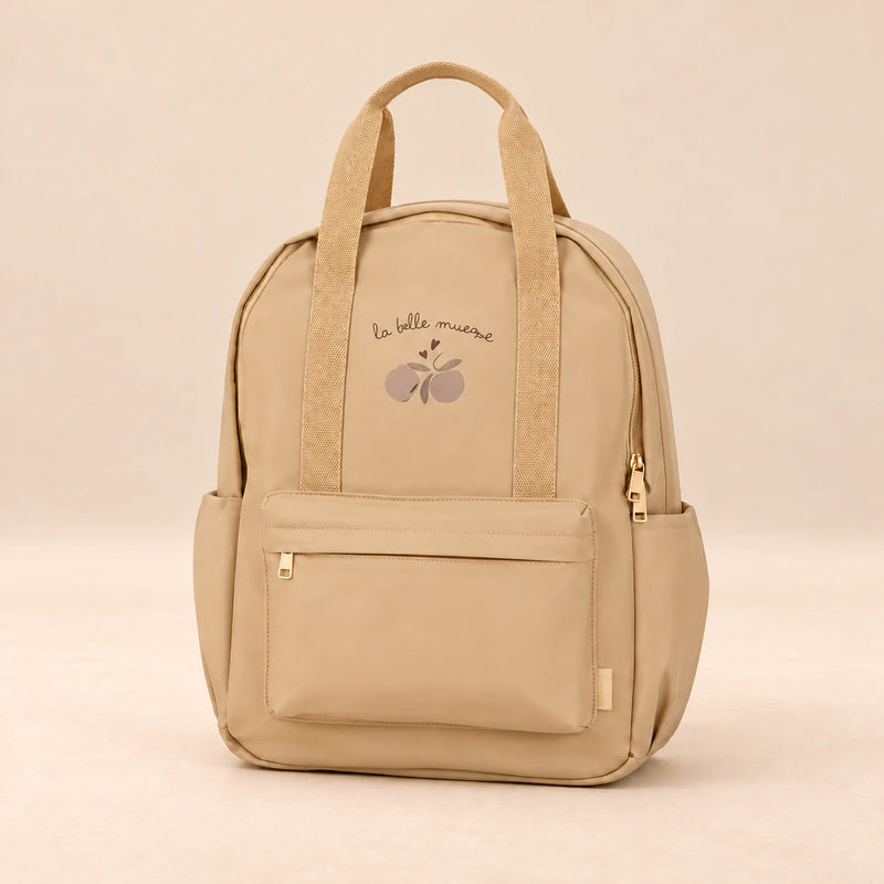 Little Explorer Large Backpack. Honey Bear Cream. Clean product photograph on a warm beige studio surface.
