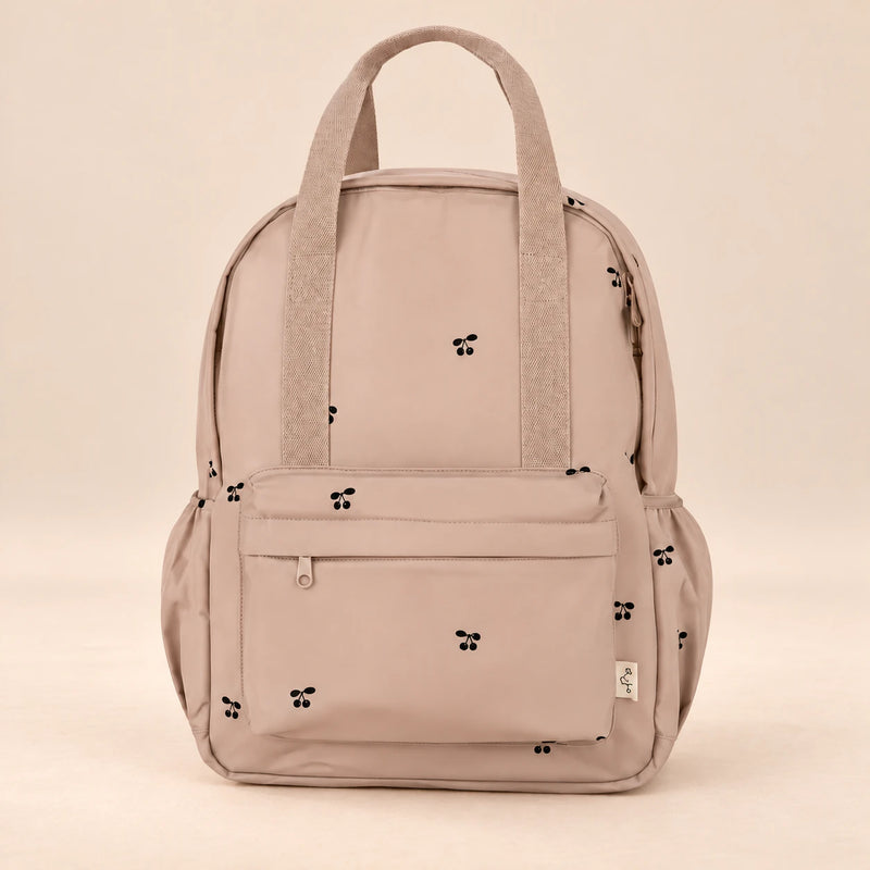 Little Explorer Large Backpack. Tiny Paw Blush. Clean product photograph on a warm beige studio surface.