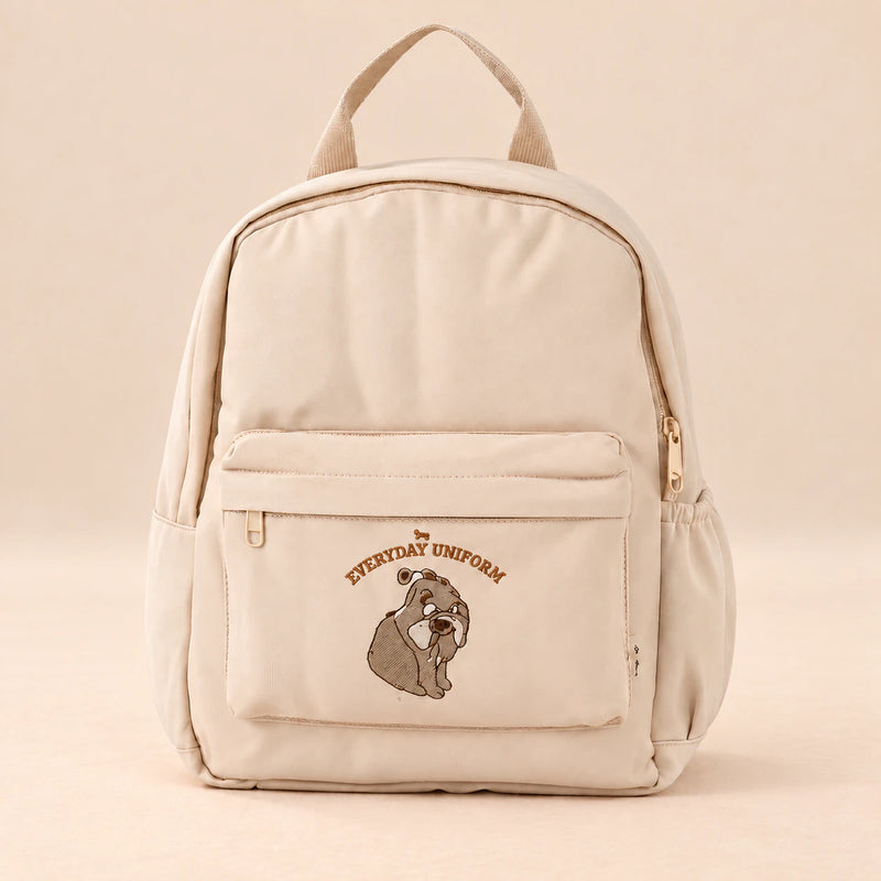 Little Explorer Large Backpack. Gentle Bear Cream. Clean product photograph on a warm beige studio surface.