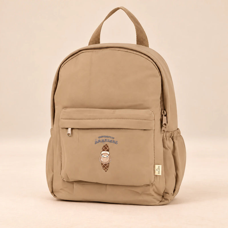 Little Explorer Large Backpack. Teddy Cocoa Tan. Clean product photograph on a warm beige studio surface.