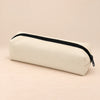 Everyday Pencil Pouch. Clean product photograph on a warm beige studio surface.