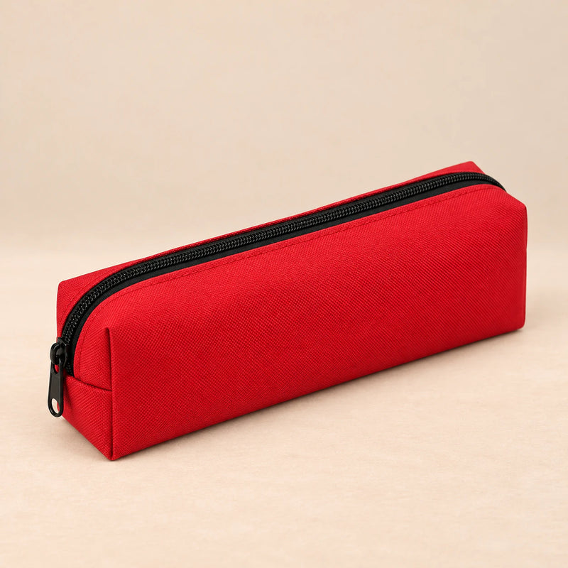 Everyday Pencil Pouch. Cherry Red. Clean product photograph on a warm beige studio surface.