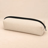 Everyday Pencil Pouch. Cream Beige. Clean product photograph on a warm beige studio surface.