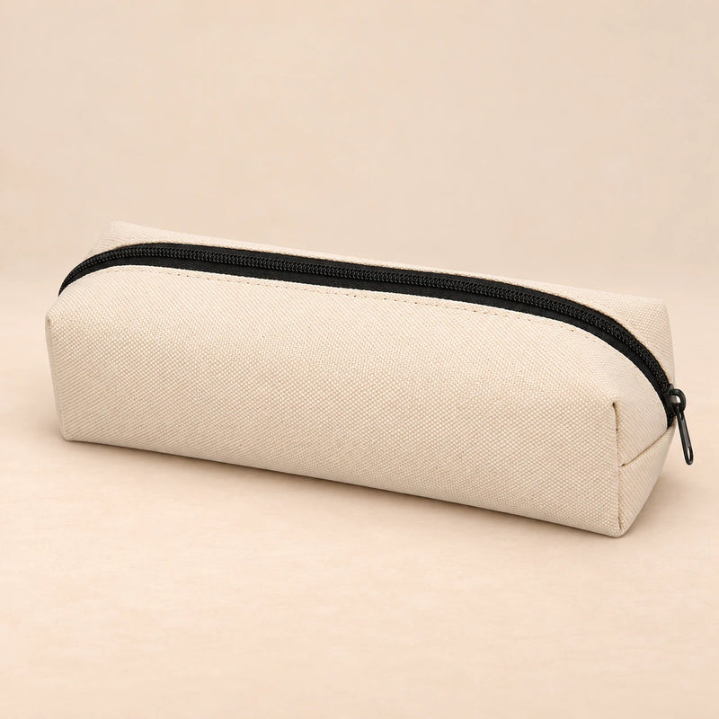 Everyday Pencil Pouch. Cream Beige. Clean product photograph on a warm beige studio surface.