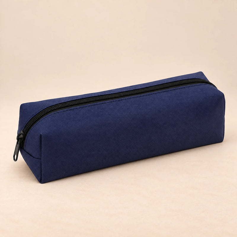 Everyday Pencil Pouch. Navy Blue. Clean product photograph on a warm beige studio surface.