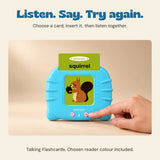 A hand presses the blue talking reader button while the original squirrel card is inserted. Blue or pink reader is included according to the chosen bundle.
