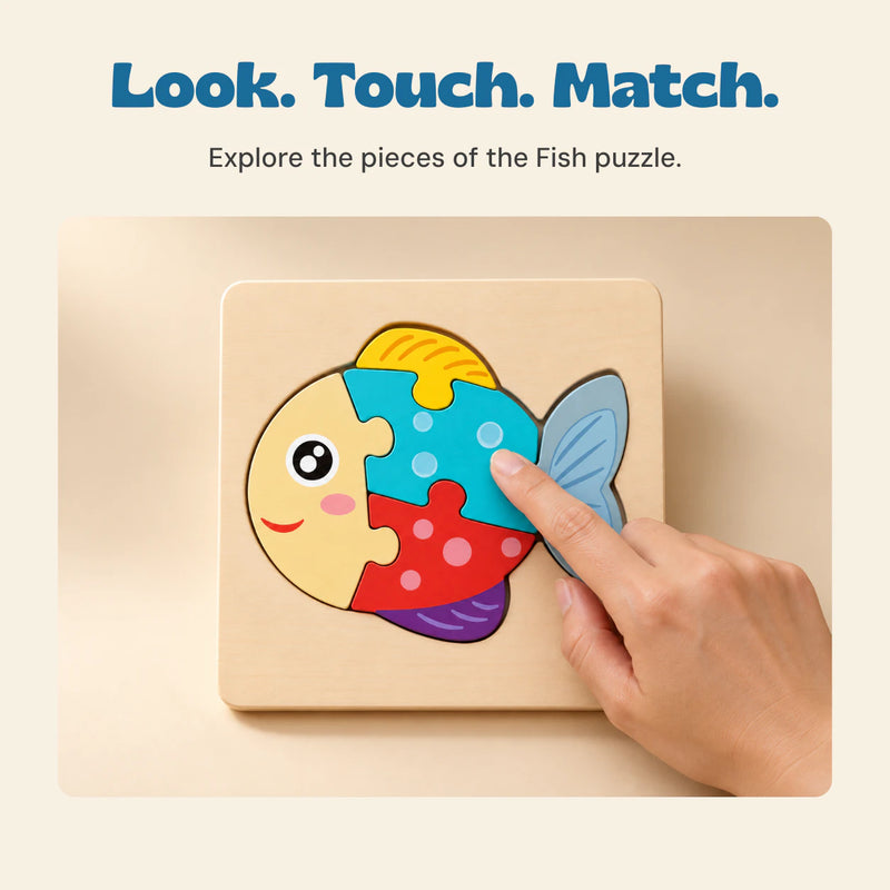 An adult hand touches the turquoise piece of the assembled Fish wooden puzzle on a warm beige surfacetop.