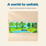 The included Wild Forest reusable sticker book opens to its green woodland scene, trees and stream.