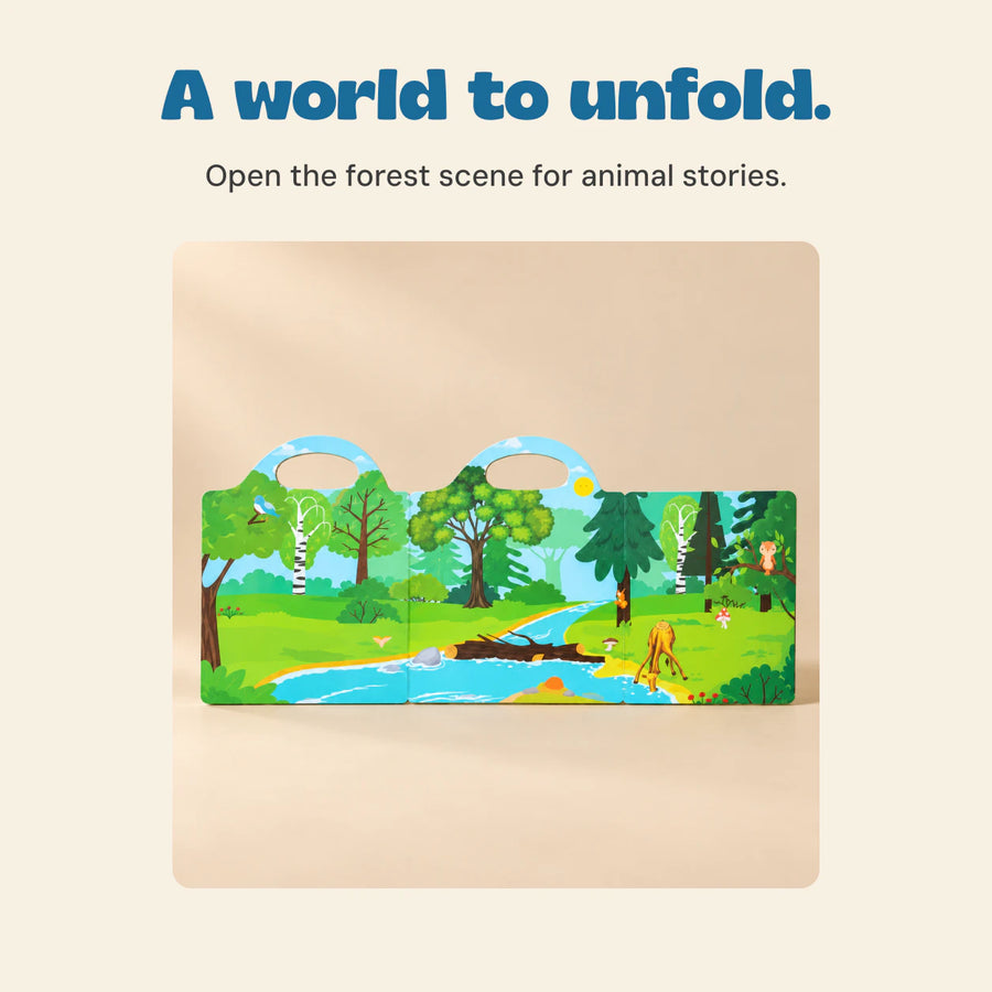 The included Wild Forest reusable sticker book opens to its green woodland scene, trees and stream.