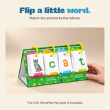 A hand steadies the green four-ring CVC flip book showing a cat and the letters c, a and t.