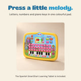 Yellow Spanish learning tablet with pink letter buttons, numbered piano keys and illustrated display.