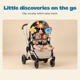 Little discoveries on the go. Clip-on play within easy reach.