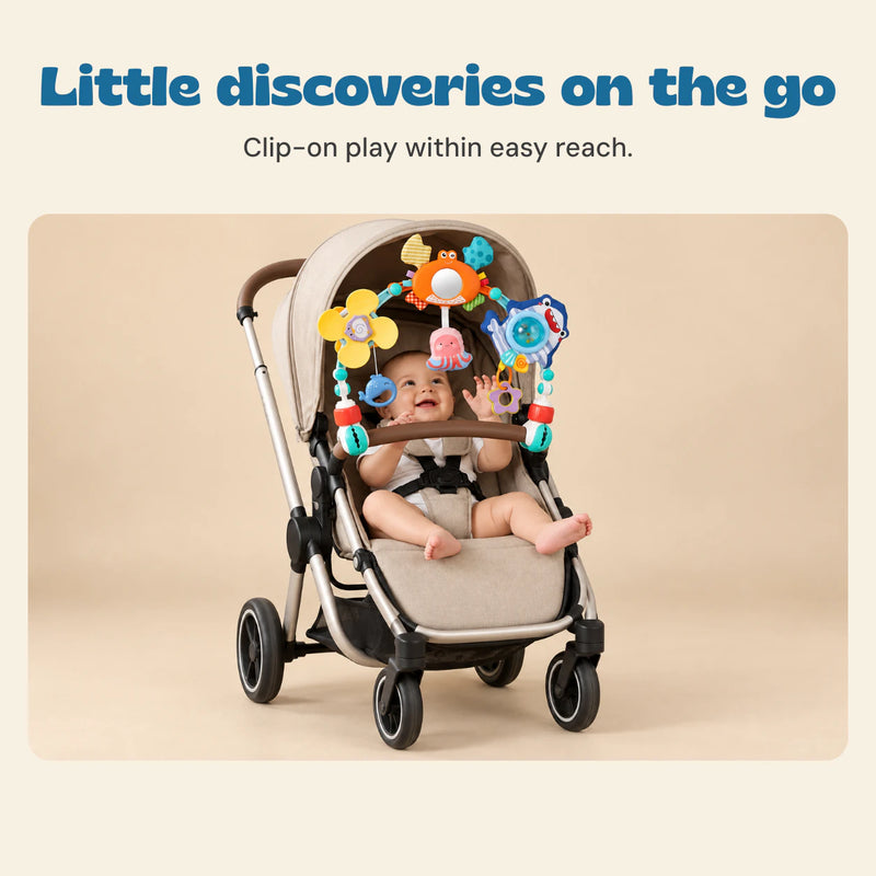 Little discoveries on the go. Clip-on play within easy reach.