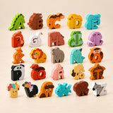 Animal Alphabet Puzzle Set. Clean product photograph on a warm beige studio surface.