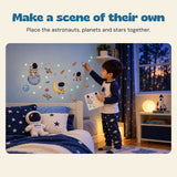 Make a scene of their own. Place the astronauts, planets and stars together.