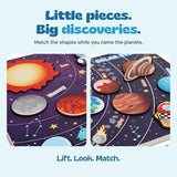 Close-up views of the Galaxy Match board showing the real planet pieces and printed matching artwork.