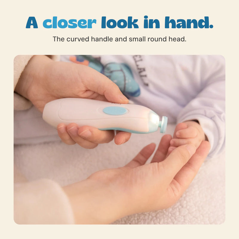 Original close-up photograph of an adult holding the blue trimmer beside a baby's hand.