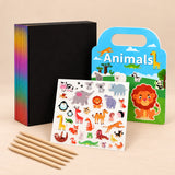 Scratch and Sticker Gift Duo with a black scratch art pack, five wooden styluses and the Animals PuffyScene book with its sticker sheet on a beige studio surface.