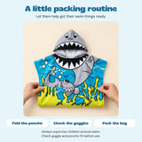 Hands fold the actual Blue Cloud Plush shark poncho, with a simple fold, check and pack routine.