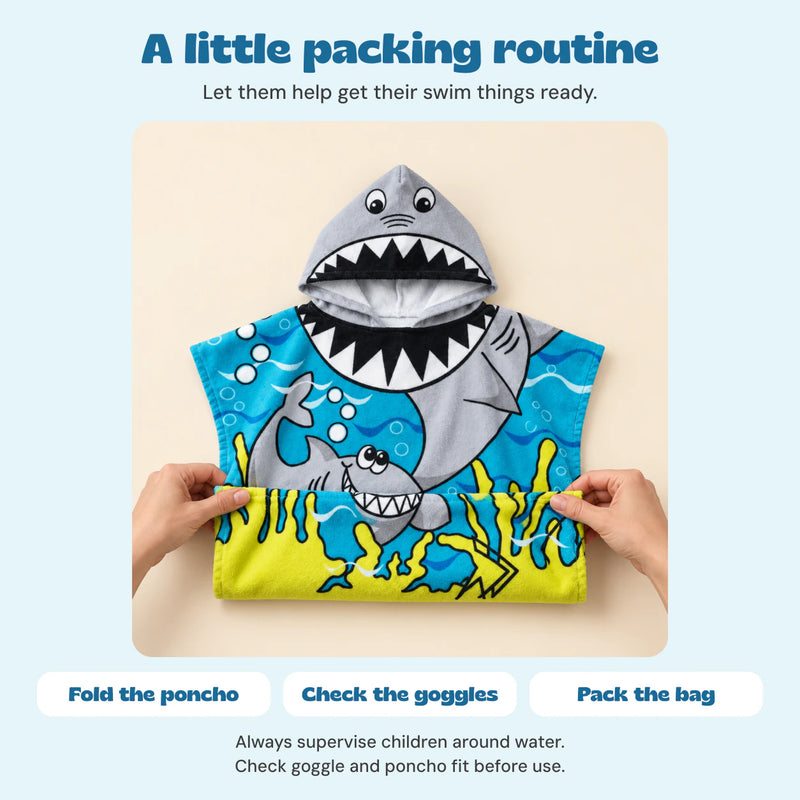 Hands fold the actual Blue Cloud Plush shark poncho, with a simple fold, check and pack routine.