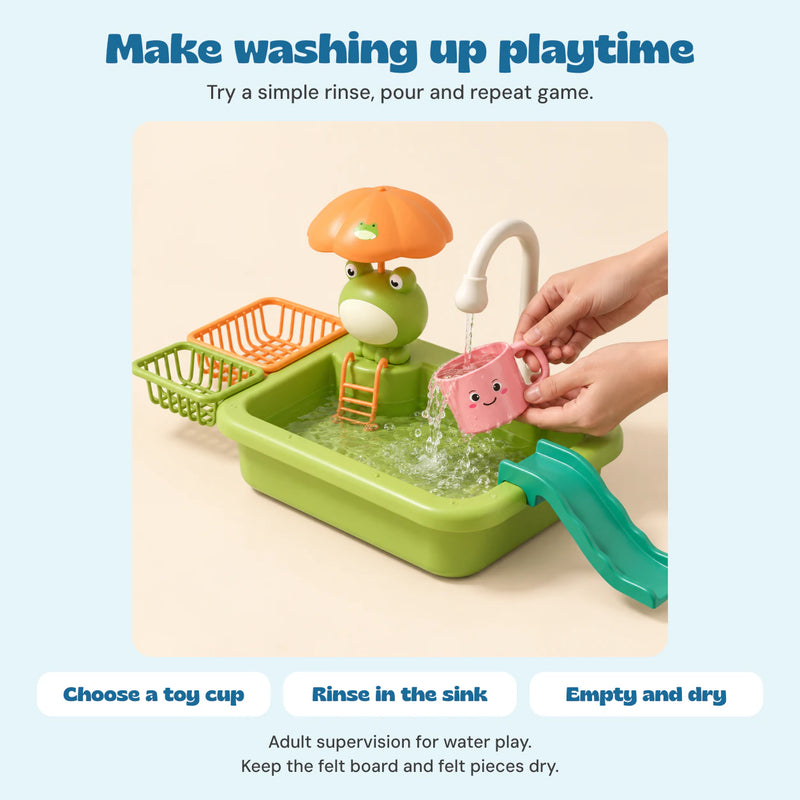 Adult hands rinse a toy pink cup under the Froggy Wash Station faucet. Felt pieces stay dry.