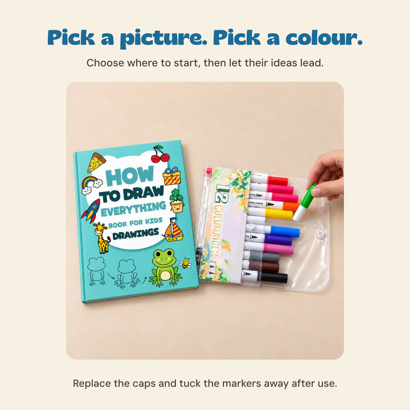 A hand choosing the green marker from the twelve-colour pouch beside the closed Frog Drawing Adventure workbook.