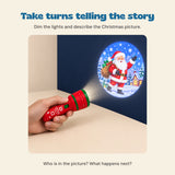 A hand holding the red Christmas flashlight projector toward its Santa picture. A shared play prompt asks who is in the picture and what happens next.