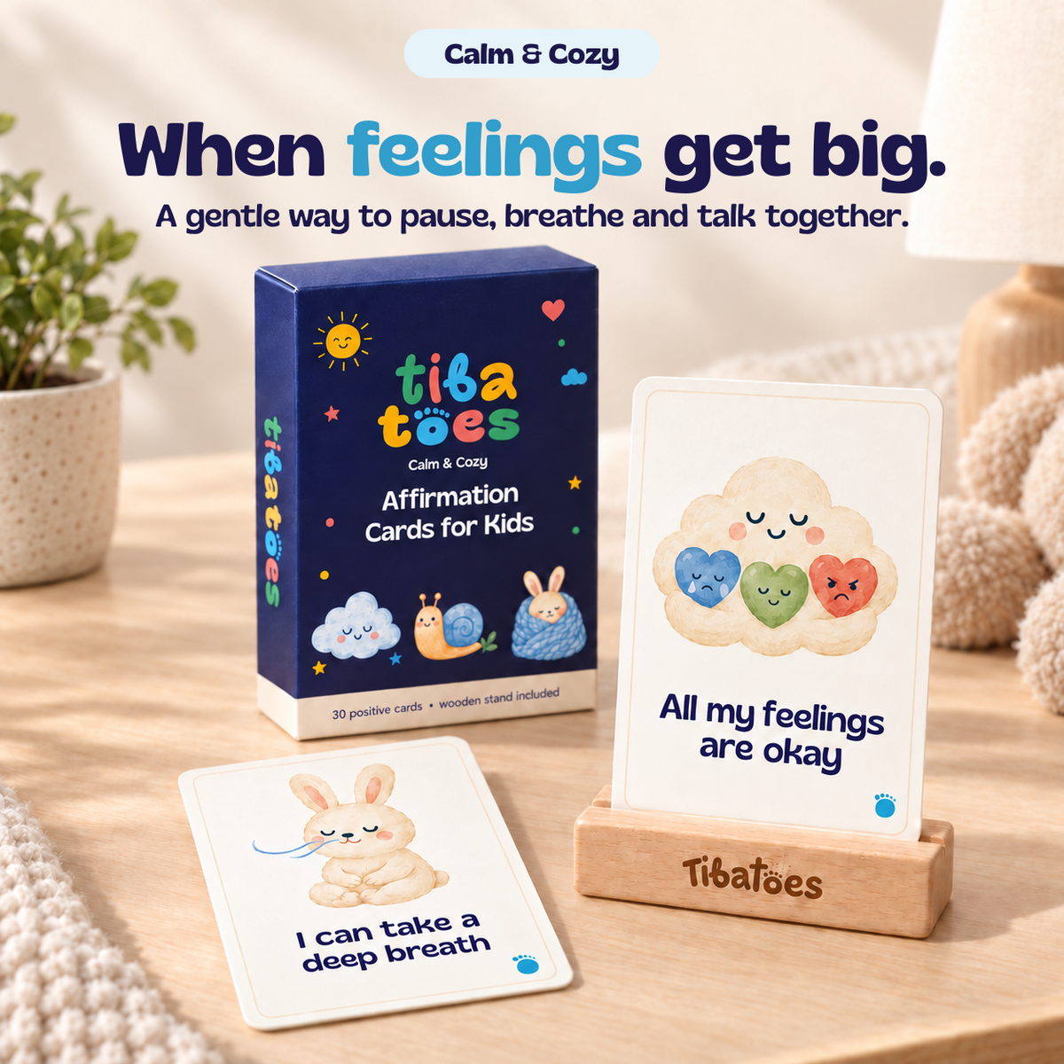 When feelings get big. A gentle way to pause, breathe and talk together. Calm & Cozy affirmation cards with the matching box and wooden stand. Generated explainer mockup.