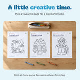 Three actual Halloween colouring pages laid out on an oak table beside a pencil pouch and crayons.