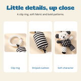 Close views of the white clip ring, striped cushion and patterned bear fabric.