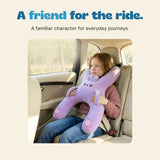A girl holds the lavender bunny travel pillow while seated in a car.