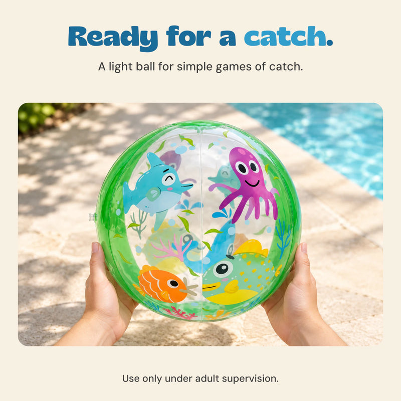 Adult hands hold the Ocean Friends beach ball beside a pool. Use only under adult supervision.