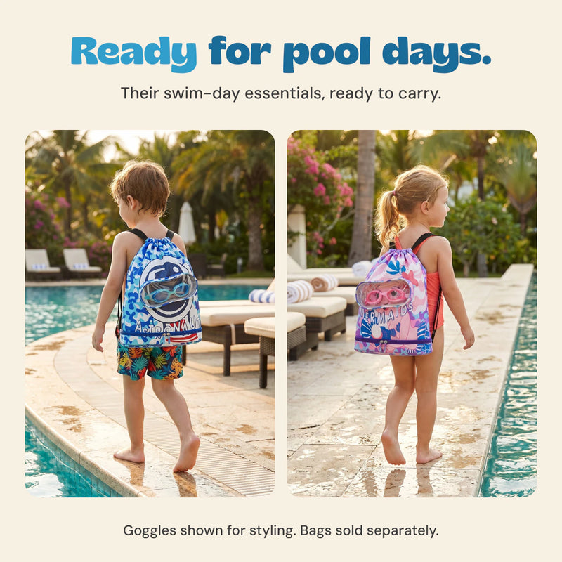 The existing product photos show a child carrying the blue astronaut swim bag and a child carrying the pink mermaid swim bag beside a pool. Bags sold separately; goggles are styling accessories.
