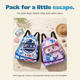 Blue and pink swim bags on sand in the original beach setting. Choose one bag; accessories shown are not included.