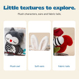 Details of the Animal Kingdom sensory book: plush owl, soft rabbit ears and striped fabric tail.
