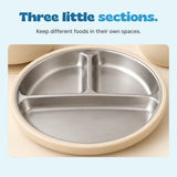 Close view of the exact three-section stainless steel plate, two smaller sections at the back and one larger section in front.